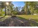 Spacious backyard with fire pit and mature trees at 4893 Sw 4Th Cir, Ocala, FL 34471