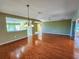 Spacious dining room with hardwood floors and kitchen access at 13166 Se 86Th Cir, Summerfield, FL 34491