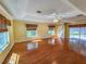 Spacious living room featuring hardwood floors and a view to backyard at 13166 Se 86Th Cir, Summerfield, FL 34491