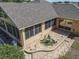 Stone patio with a unique dolphin fountain and pathway at 13166 Se 86Th Cir, Summerfield, FL 34491