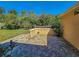 Brick paved patio with landscaping and access to the house at 13166 Se 86Th Cir, Summerfield, FL 34491