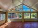 Bright sunroom with multiple windows and tile floors at 13166 Se 86Th Cir, Summerfield, FL 34491