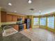 Kitchen with wood cabinets, stainless steel appliances, and breakfast nook at 13166 Se 86Th Cir, Summerfield, FL 34491