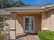 Front entryway with a glass paneled door at 13166 Se 86Th Cir, Summerfield, FL 34491