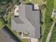 Top-down aerial view showcasing the roofline and backyard of a single-story home at 13166 Se 86Th Cir, Summerfield, FL 34491