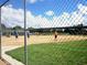 Baseball field with players in action, viewed from behind fence at 13166 Se 86Th Cir, Summerfield, FL 34491