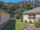 Neat side yard with well-maintained grass and shrubs at 13166 Se 86Th Cir, Summerfield, FL 34491