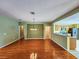 Well-lit dining room with hardwood floors and kitchen views at 13166 Se 86Th Cir, Summerfield, FL 34491