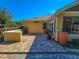 Brick paved patio with landscaping and access to the house at 13166 Se 86Th Cir, Summerfield, FL 34491