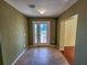 Tiled entryway with interior door and access to other rooms at 13166 Se 86Th Cir, Summerfield, FL 34491