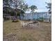 Large backyard with a swing set and painted storage container at 34828 1St Ave, Leesburg, FL 34788