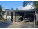 Home with carport, featuring off-street parking and storage at 34828 1St Ave, Leesburg, FL 34788