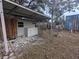 Backyard patio with shed, playset, and outdoor sink at 34828 1St Ave, Leesburg, FL 34788