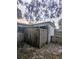 Backyard with a wooden fence and a small patio area at 34828 1St Ave, Leesburg, FL 34788