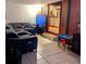 Living room with sectional sofa and large TV at 34828 1St Ave, Leesburg, FL 34788