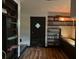 Living room with built-in shelving and hardwood floors at 34828 1St Ave, Leesburg, FL 34788