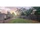 Backyard with a wooden fence and grassy area at 34828 1St Ave, Leesburg, FL 34788