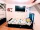 Cozy bedroom with a bed, TV, and ample closet space at 34828 1St Ave, Leesburg, FL 34788
