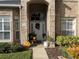 Front door entrance with seasonal decor at 3403 Gatlin Place Cir, Orlando, FL 32812
