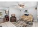 Living room with beige sofa, recliner, and ceiling fan at 2810 Se 8Th St, Ocala, FL 34471
