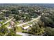 Aerial perspective of a residential area, showing houses and surrounding landscape at 2810 Se 8Th St, Ocala, FL 34471