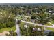 Aerial view showcasing a neighborhood's tree-lined streets and homes at 2810 Se 8Th St, Ocala, FL 34471