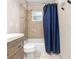 Clean bathroom with shower/tub combo, tile flooring, and a wood vanity at 2810 Se 8Th St, Ocala, FL 34471