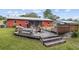 Back exterior of the house showing a large deck and backyard at 2810 Se 8Th St, Ocala, FL 34471