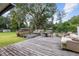 Large wooden deck with seating area, offering a relaxing outdoor space at 2810 Se 8Th St, Ocala, FL 34471