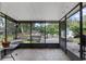 Spacious screened porch with access to a deck and backyard at 2810 Se 8Th St, Ocala, FL 34471