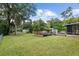 Large backyard with grassy area and deck, offering ample space at 2810 Se 8Th St, Ocala, FL 34471