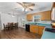Kitchen features wood cabinets, a white stove, and teal countertops at 2810 Se 8Th St, Ocala, FL 34471