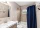 Bathroom with a tub and shower, and blue shower curtain at 2810 Se 8Th St, Ocala, FL 34471