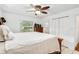 Spacious bedroom with a queen-size bed, dresser, and bathroom access at 2810 Se 8Th St, Ocala, FL 34471