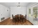 Simple dining area with wood table and chairs near sliding doors at 2810 Se 8Th St, Ocala, FL 34471