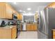 Modern kitchen with stainless steel appliances and granite countertops at 7290 Se 172Nd Legacy Ln, The Villages, FL 32162