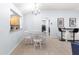 Bright dining area with a view into the kitchen and laundry area at 7290 Se 172Nd Legacy Ln, The Villages, FL 32162