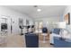 Comfortable living room with sliding doors to the patio at 7290 Se 172Nd Legacy Ln, The Villages, FL 32162