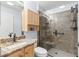 Bathroom with granite countertop, a large walk-in shower, and built-in storage at 7290 Se 172Nd Legacy Ln, The Villages, FL 32162