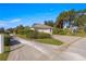 House exterior, showing a one-story home with a two-car garage and landscaped yard at 7290 Se 172Nd Legacy Ln, The Villages, FL 32162