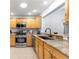 Kitchen with granite countertops and stainless steel appliances at 7290 Se 172Nd Legacy Ln, The Villages, FL 32162