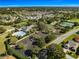 Community clubhouse, pool, tennis courts, and parking at 7290 Se 172Nd Legacy Ln, The Villages, FL 32162