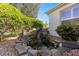Charming water feature with a small waterfall and pond, surrounded by landscaping at 7290 Se 172Nd Legacy Ln, The Villages, FL 32162