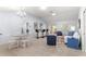 Open concept living and dining area with a breakfast bar at 7290 Se 172Nd Legacy Ln, The Villages, FL 32162