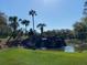 Relaxing waterfall feature with lush landscaping in a community at 6925 Sw 179Th Court Rd, Dunnellon, FL 34432