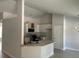 Modern kitchen with white cabinets and breakfast bar at 6925 Sw 179Th Court Rd, Dunnellon, FL 34432