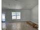 Bright and airy living room with tile flooring and large window at 6925 Sw 179Th Court Rd, Dunnellon, FL 34432