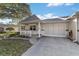 Bright and airy one-story home with a carport and nicely kept lawn at 9668 Sw 94Th Ct # A, Ocala, FL 34481