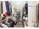 Large walk-in closet with ample storage space for clothing and shoes at 2210 Se Laurel Run Dr, Ocala, FL 34471