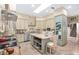Open kitchen with island, stainless steel appliances, and light-toned cabinetry at 2210 Se Laurel Run Dr, Ocala, FL 34471